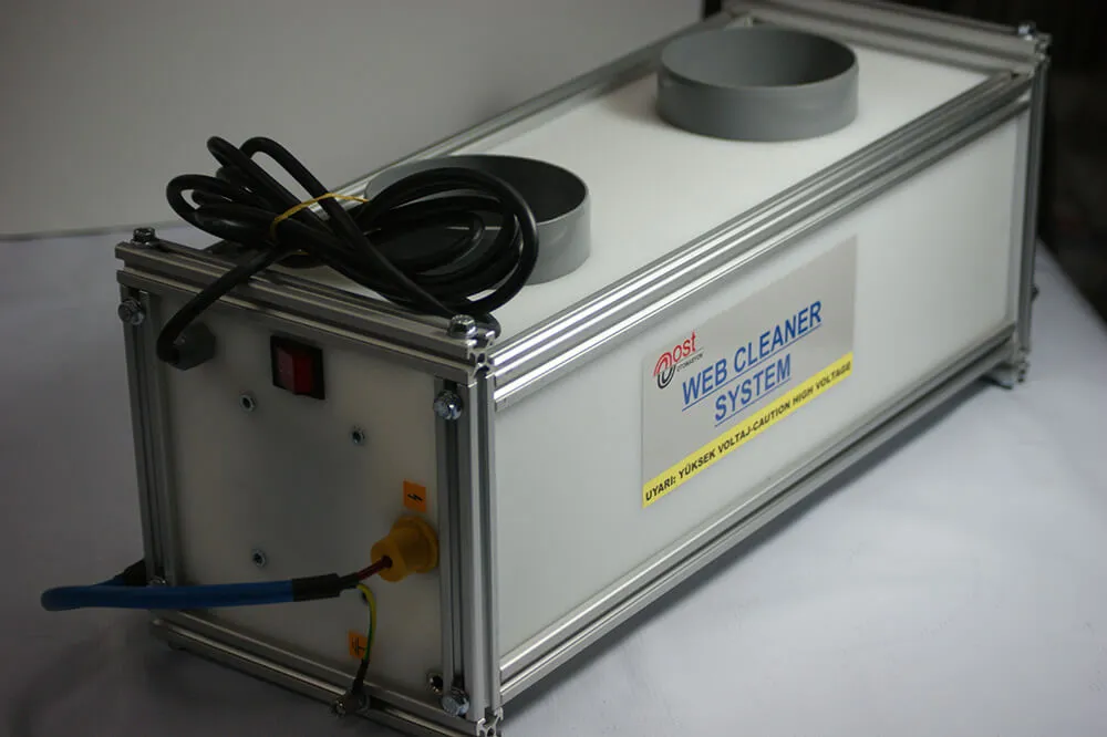 Side view of the web cleaner unit: suction ports, on/off switch and high-voltage connection
